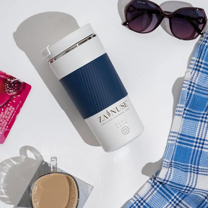 White and blue thermos with sunglasses and a plaid shirt on a light background